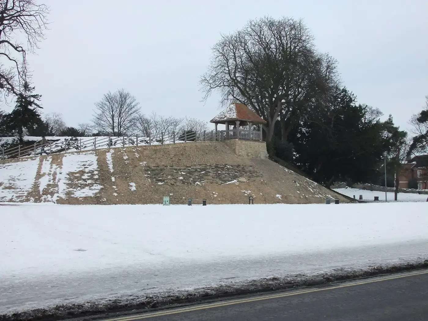 Bedford Castle Mound under snow, with a small pavilion on top